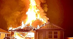 FIRE DESTROYS NEW HOME